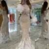 Charming Halter Pearls Tassel Dubai Evening Dresses Mermaid Long Sleeve Illusion Feathers Saudi Arabic Formal Party Gown