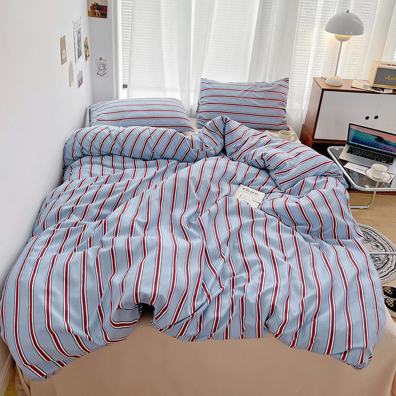 Simple Red and Blue Striped Duvet Cover and Four Piece Bed Sheet Set with Washed Cotton Bedding on the Bed - Image 2