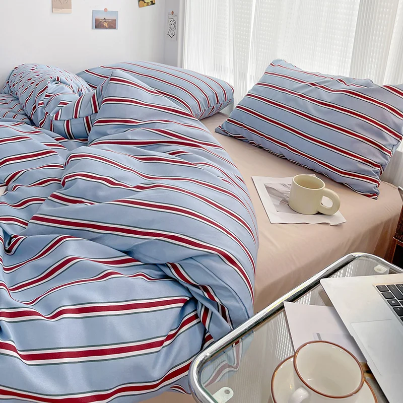 Simple Red and Blue Striped Duvet Cover and Four Piece Bed Sheet Set with Washed Cotton Bedding on the Bed - Image 4